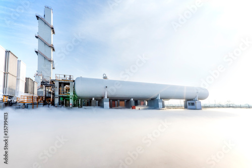View of the large high pressure horizontal chemical (liquid nitrogen) cryogenic storage tank. Cryotank or cryogenic tank is a tank that is used to store frozen biological material. photo