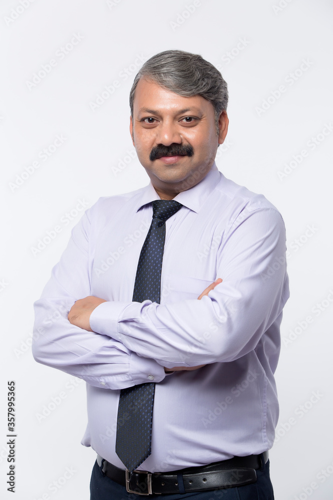 Good looking mature Indian male with business suit isolated on white background. Good looking mature Indian male with business suit isolated on white background.