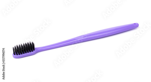 purple plastic toothbrush for personal hygiene  isolated on a white background