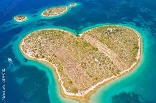 Croatia, beautiful coastline on Adriatic sea, romantic heart shaped island of Galesnjak in turquoise sea in Murter archipelago, aerial view of from drone 