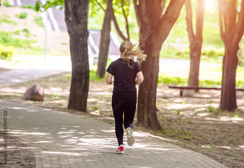 Girl makes a run to the summer Park
Girl makes a run to the summer Park