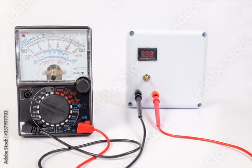 Analog voltmeter is combines several measurement functions in one unit.
 photo