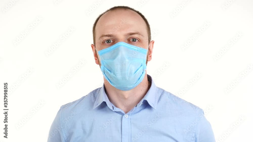 Pandemic, portrait of a young man wearing protective mask isolated on white background. Pandemic, portrait of a young man wearing protective mask isolated on white background.