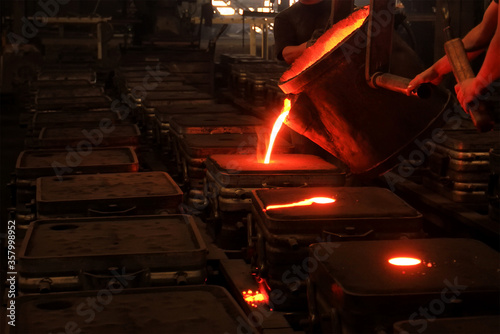 Traditional smeltery. In metalworking and jewellery making, casting is a process in which a liquid metal is somehow delivered into a mold that contains a negative impression of the intended shape. photo