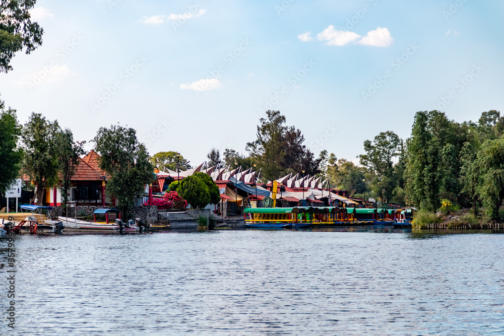 Panoramic view of Xochimilco channels or canals along the floating gardens or Chinampas in Mexico city at sunset