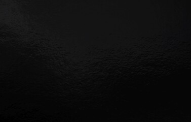 Black foil gradient texture background with uneven surface
