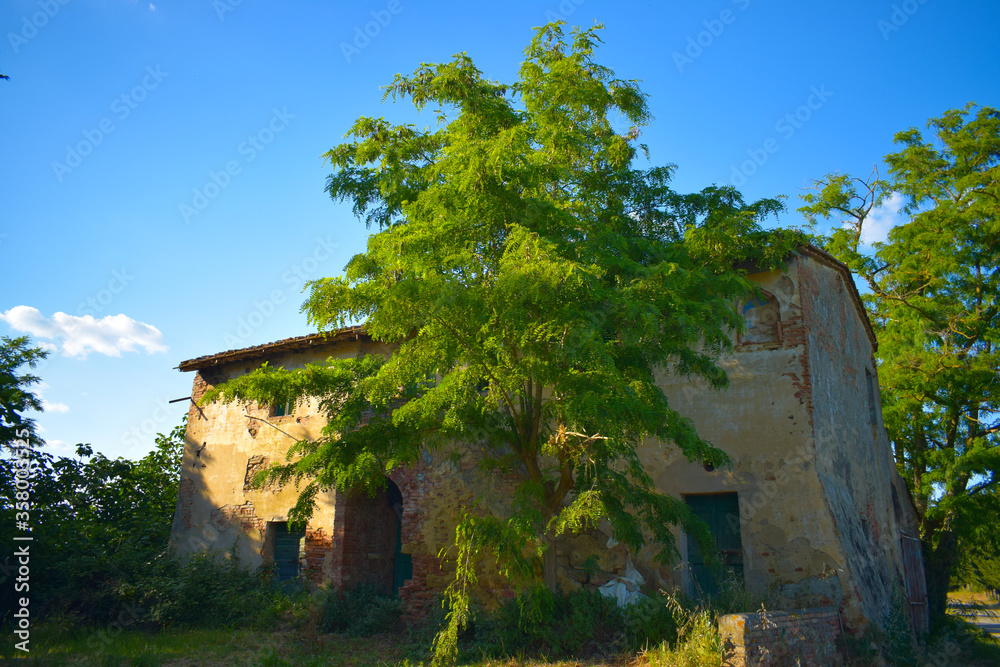 Fototapeta premium Old building in a sunny spring day with blue sky in Peccioli countryside, Valdera, Tuscany. Italy