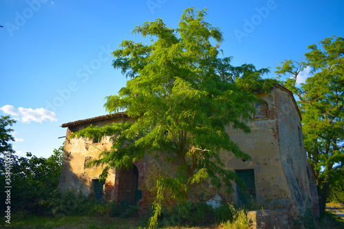 Old building in a sunny spring day with blue sky in Peccioli countryside, Valdera, Tuscany. Italy photo