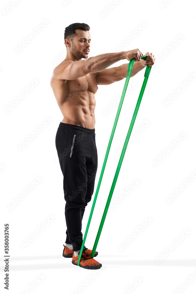 Bodybuilder training shoulders using resistance band. Bodybuilder training shoulders using resistance band.