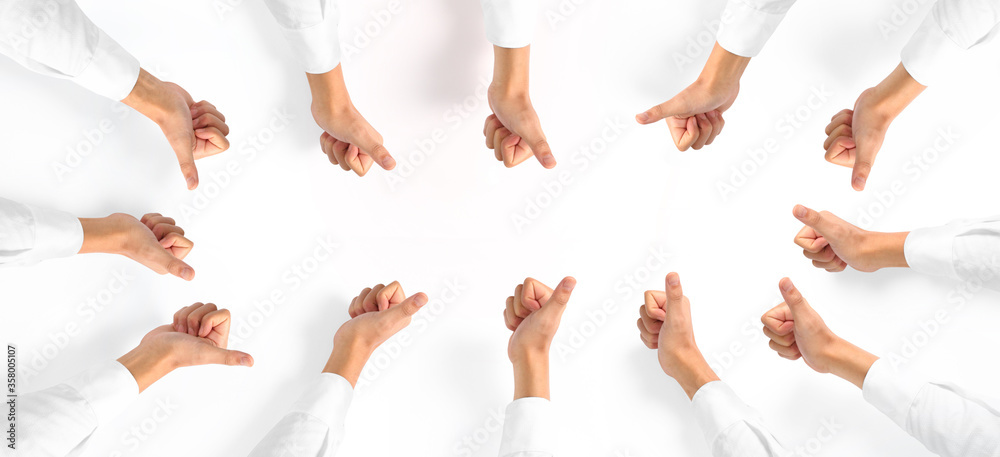 Line of group human hands showing thumbs up Top view