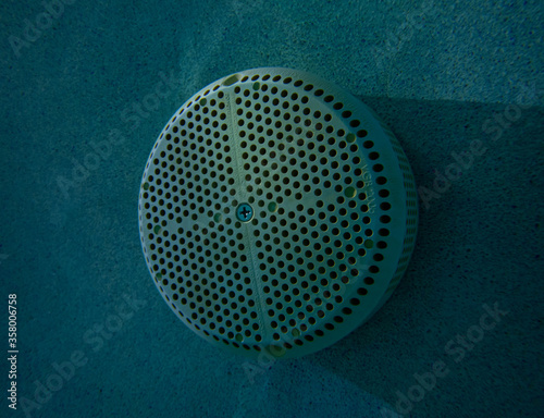 Pool suction equalizer, at night