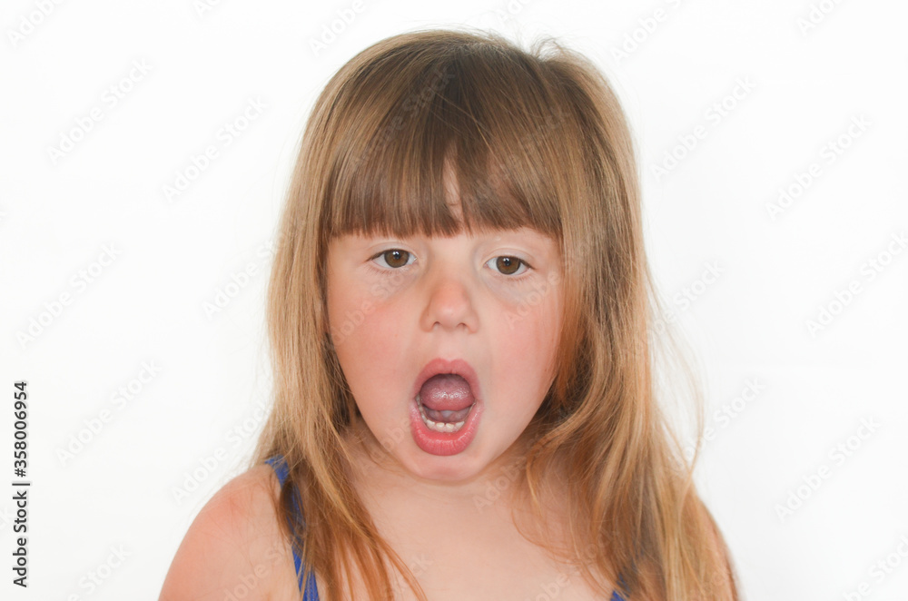 Surprised child opened his mouth on a white background isolated