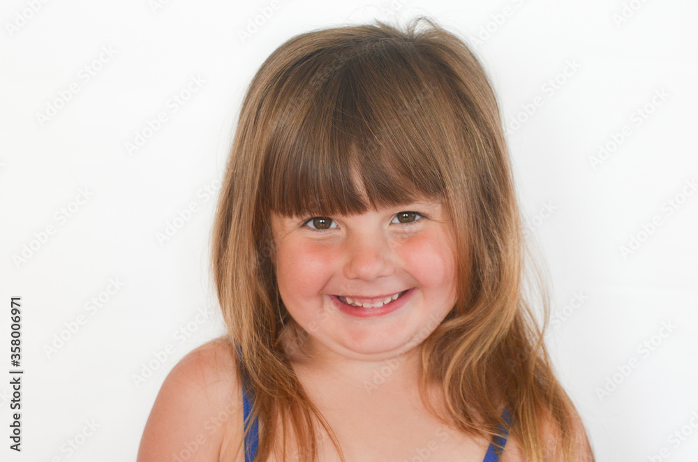 Portrait of a happy smiling european child looking at the camera isolated on a white background Portrait of a happy smiling european child looking at the camera isolated on a white background