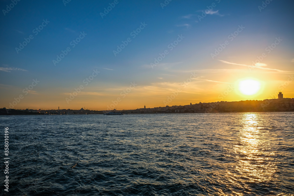 Fototapeta premium Beautiful scenic view of Istanbul during sunset in Bosphorus Bridge, Turkey. Eastern travel history city concept