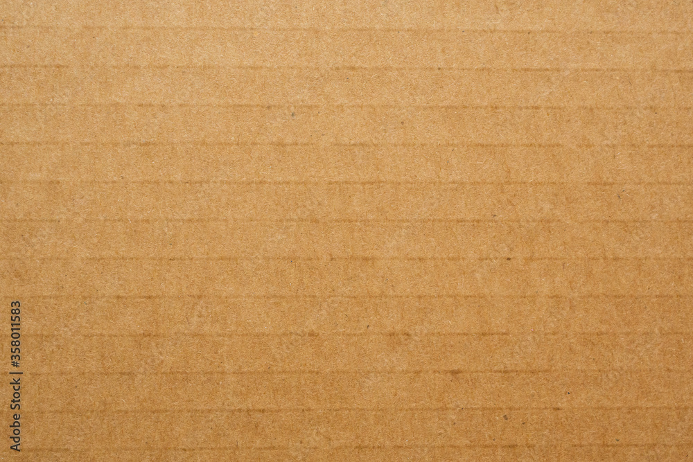Fototapeta premium Brown eco recycled cardboard paper sheet texture background