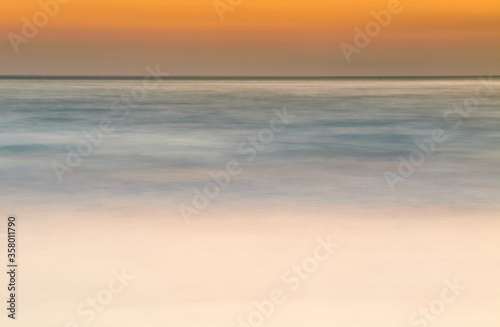 abstract sunrise of soft colors, Laredo beach © carlos perez gomez
