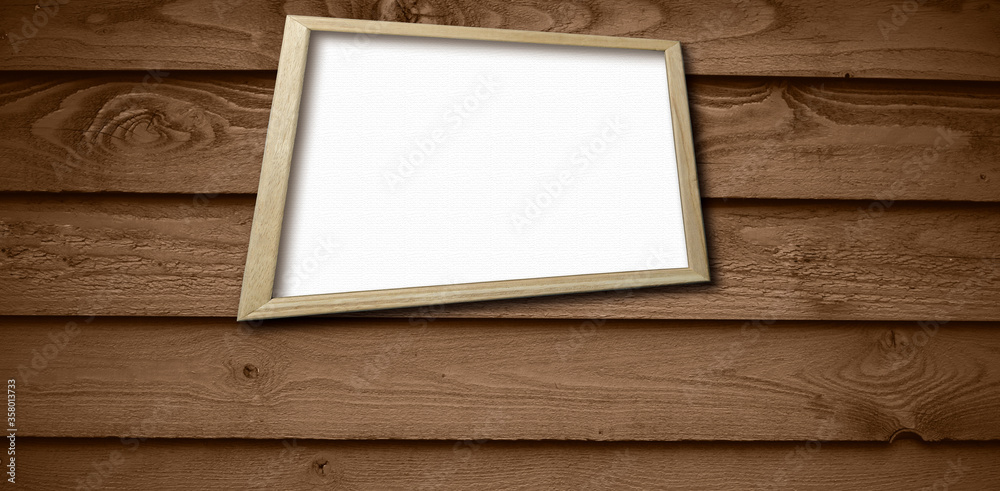Fototapeta premium blank white frame on wooden background.