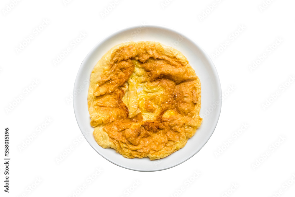 Above view of omelette in ceramic plate isolated on white background. Omelet it's egg fry popular traditional Thai asia style food. Top view Above view of omelette in ceramic plate isolated on white background. Omelet it's egg fry popular traditional Thai asia style food. Top view