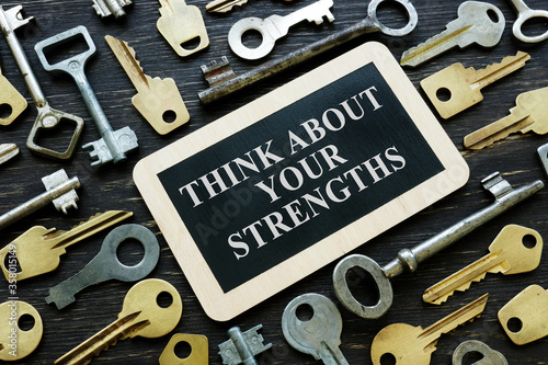 Think about your strengths phrase and old metal keys. photo