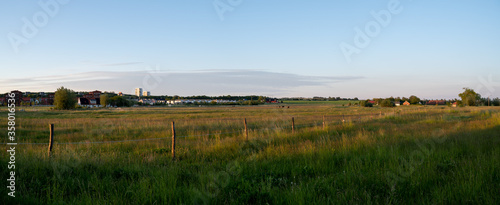 Panoramic view during sunset over the farmlands in the outskirts of the university town of Lund, Sweden