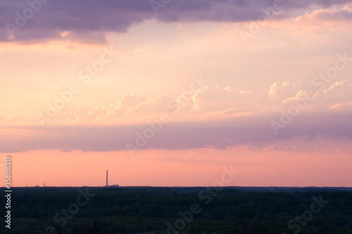 Amazing red sunset  clouds and the dark silhouette of the city