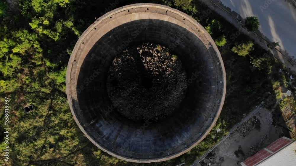 Coal plant tower seen from top down with circled shape built from prefabricated cement walls Coal plant tower seen from top down with circled shape built from prefabricated cement walls