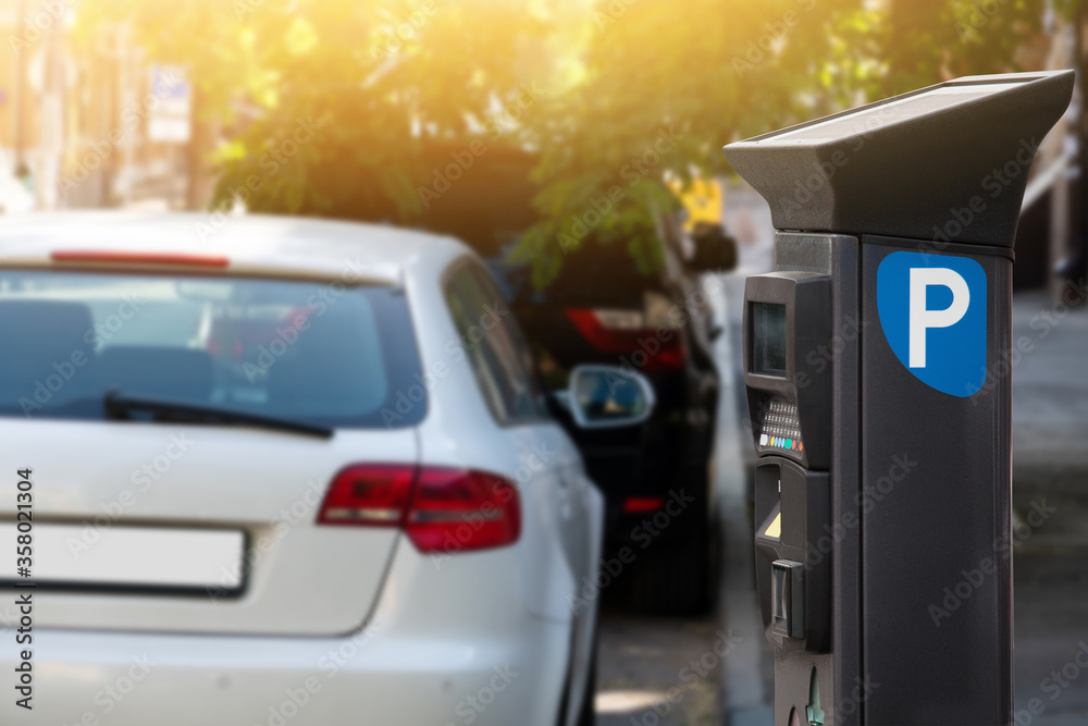 Parking machine with solar panel in the city street. Pay On Foot Parking System Parking machine with solar panel in the city street. Pay On Foot Parking System