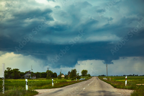 Severe supercell storm clouds with wall cloud and intense rain