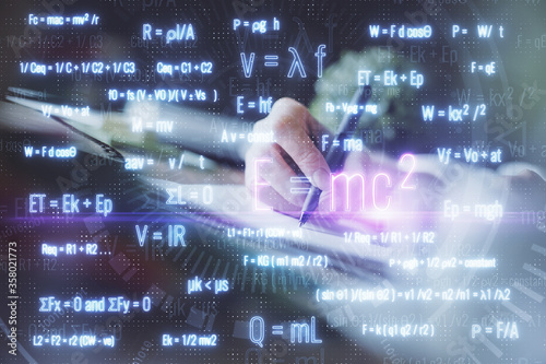 Science formula hologram over woman's hands taking notes background. Concept of study. Double exposure