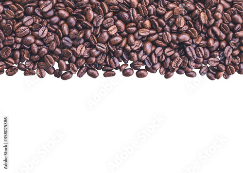 Brown dark roasted coffee beans isolated on white background. Photos from the top view and copy space. Seed nature from the above view. Group agriculture grain arabica.