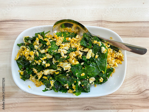 Stir-fried Malindjo leaves with egg on the table, this menu is favorite in the south of Thailand photo