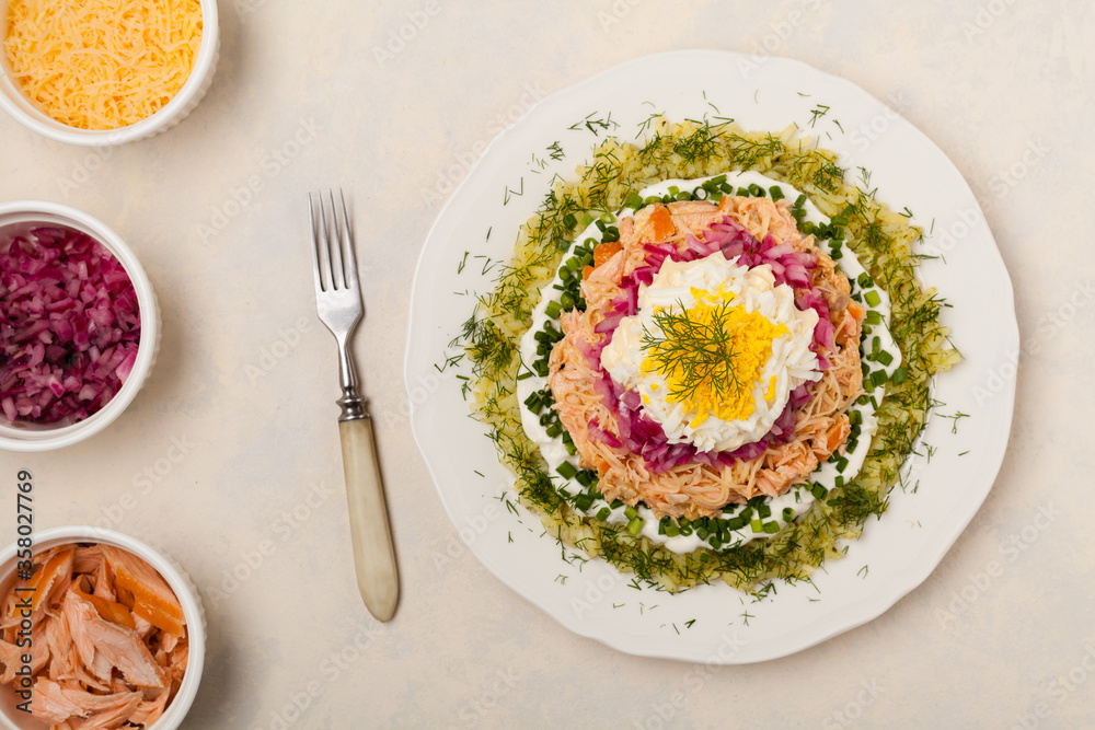 Traditional Russian Mimosa salad with salmon cheese and potatoes. Top view Traditional Russian Mimosa salad with salmon cheese and potatoes. Top view