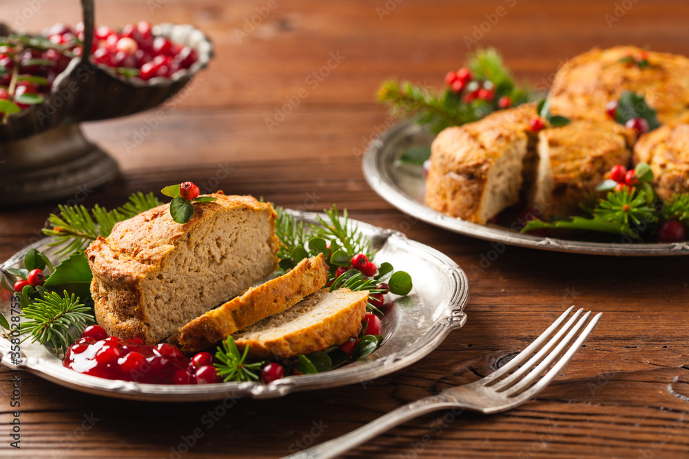 Small, baked patties in Christmas retro styling. Front view. Natural wooden background.