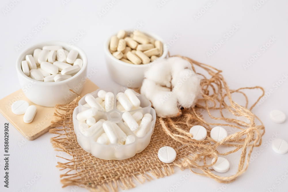 Vitamins and organic dietary supplements  to support human`s health and immunity on a white background.