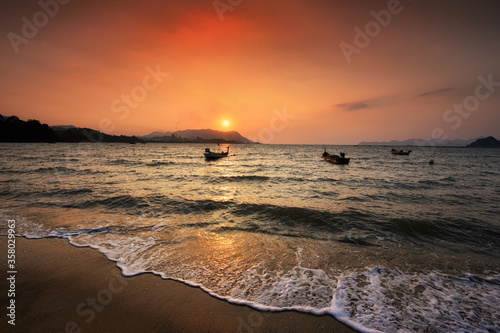 Beautiful sunset at black sand beach, Langkawi island, malaysia
