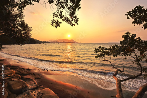 Beautiful sunset at black sand beach, Langkawi island, malaysia