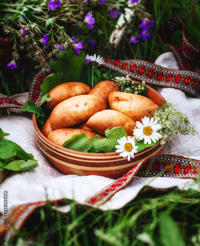 Midsummer in Latvia. Latvia summer. Traditional Latvian midsummer food. Celebration of Ligo in june decorating home with field flower bouquet. Symbolism of Latvia for Ligo holiday.