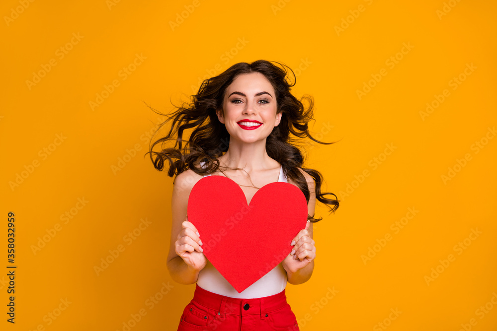 Photo of pretty lady hairstyle flight warm breeze blowing overjoyed hold big paper heart postcard lovers day wear white casual singlet red skirt isolated yellow color background Photo of pretty lady hairstyle flight warm breeze blowing overjoyed hold big paper heart postcard lovers day wear white casual singlet red skirt isolated yellow color background
