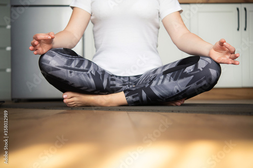 Girl sitting on the floor in yoga pose
