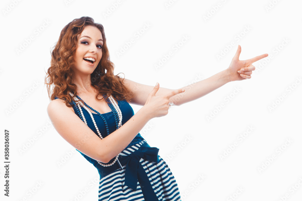 Smiling happy brunette woman pointing with finger aside isolated on white Smiling happy brunette woman pointing with finger aside isolated on white
