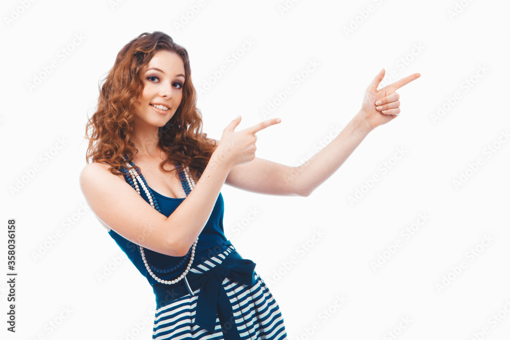 Smiling happy brunette woman pointing with finger aside isolated on white Smiling happy brunette woman pointing with finger aside isolated on white