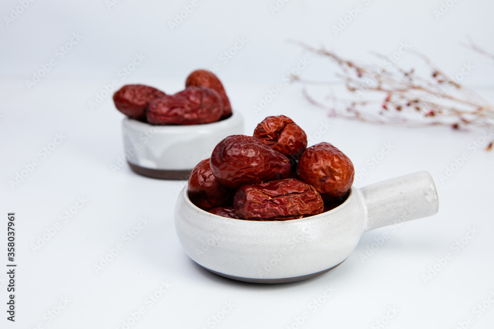 Fotografie Dry red jujubes isolated on white background.