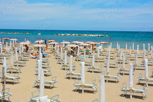 Fototapeta Naklejka Na Ścianę i Meble -  beach on the adriatic sea. Umbrellas and sunbeds.