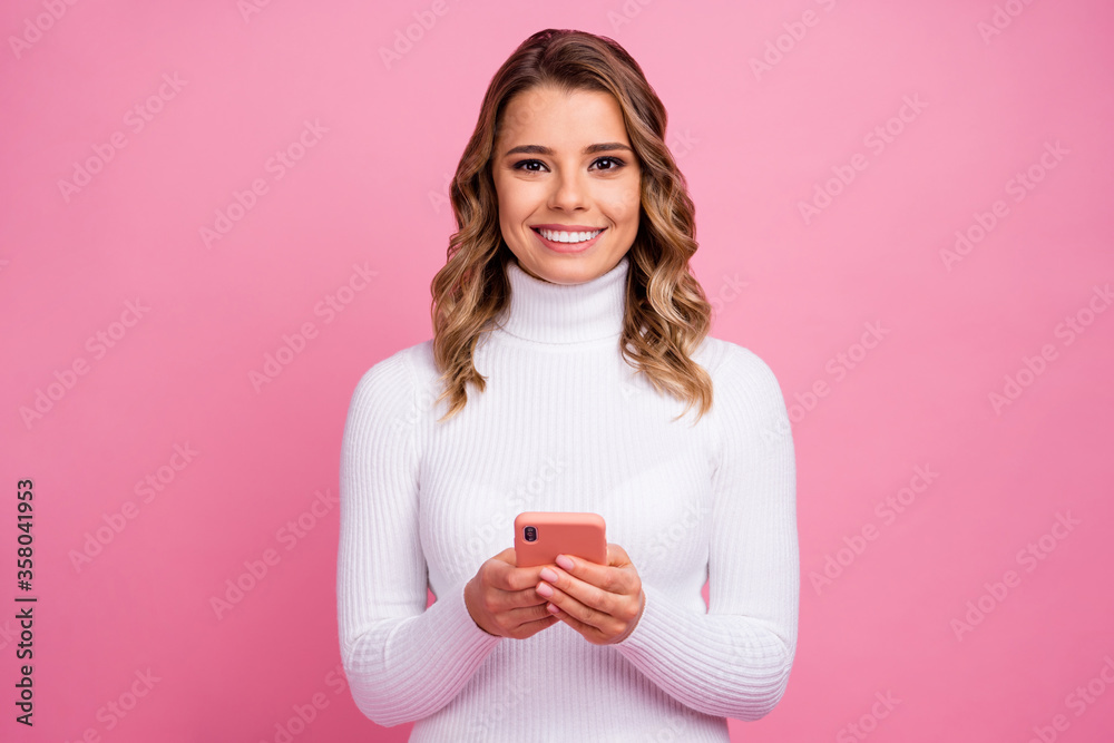 Close-up portrait of her she nice-looking attractive lovely pretty charming gorgeous cheerful cheery wavy-haired girl using device spending time isolated on pink pastel color background Close-up portrait of her she nice-looking attractive lovely pretty charming gorgeous cheerful cheery wavy-haired girl using device spending time isolated on pink pastel color background