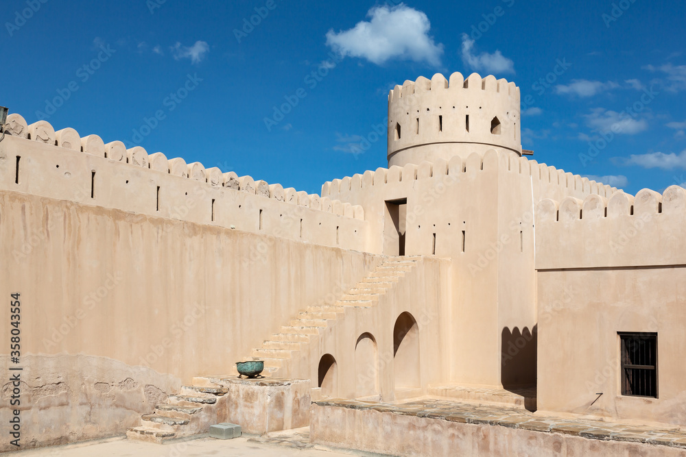 Walls, stairs and tower of Sunaysilah fort in town of Sur, Oman