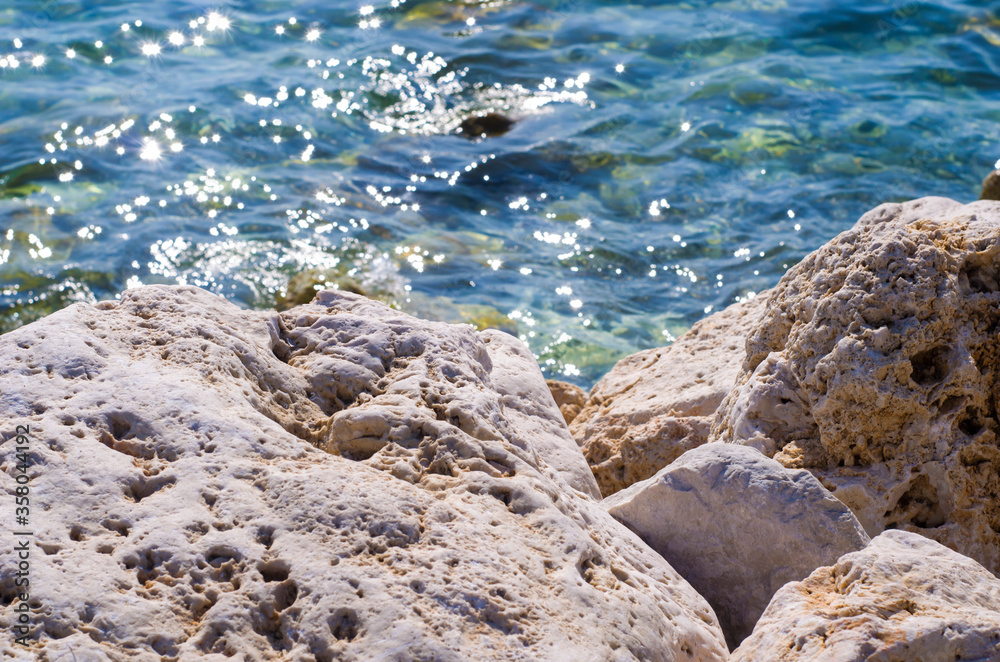 Turquoise shallow water surface and rocks stones on sea floor. Turquoise shallow water surface and rocks stones on sea floor.