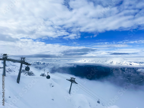 Funicular cabins on a background of a winter landscape