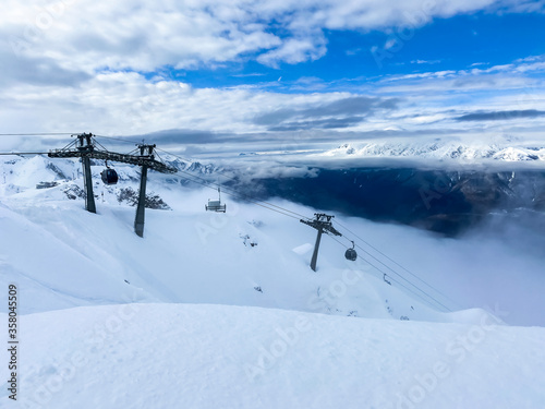 Funicular cabins on a background of a winter landscape