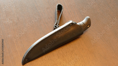 a set of large knives in a sheath