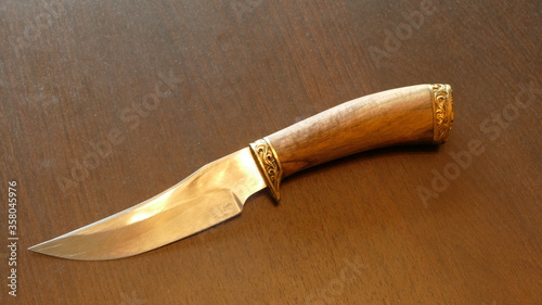 a set of large knives in a sheath